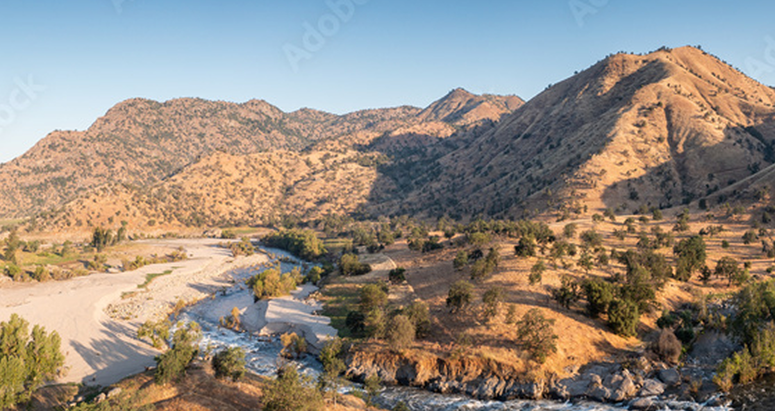 An image of a water stream in a desert landscape