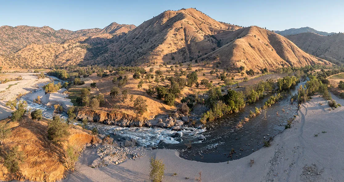 An image of a water stream in a desert landscape
